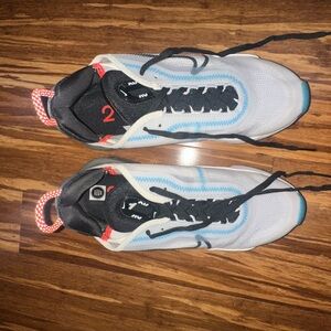 One pair of women’s size 7.5 Nike 2090 tennis shoes